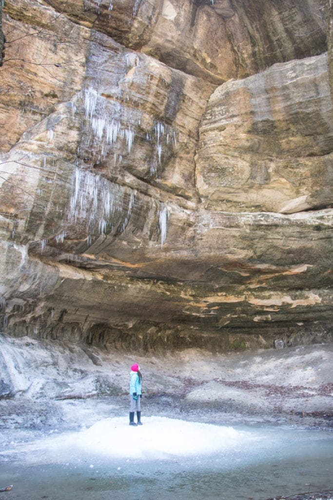 Article Title: Funny Hiking Quotes for Instagram.
Picture description: Starved Rock in the winter. Girl standing in a frozen canyon with large icicles everywhere. 