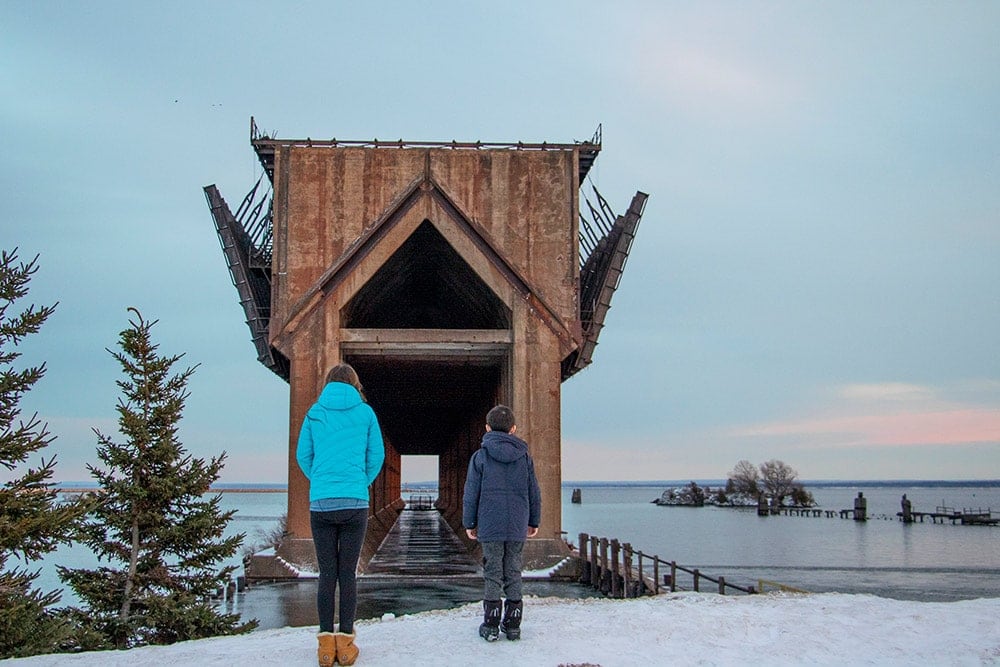 Kids looking at an abandoned ore dock in Marquette | Michigan's Upper Peninsula