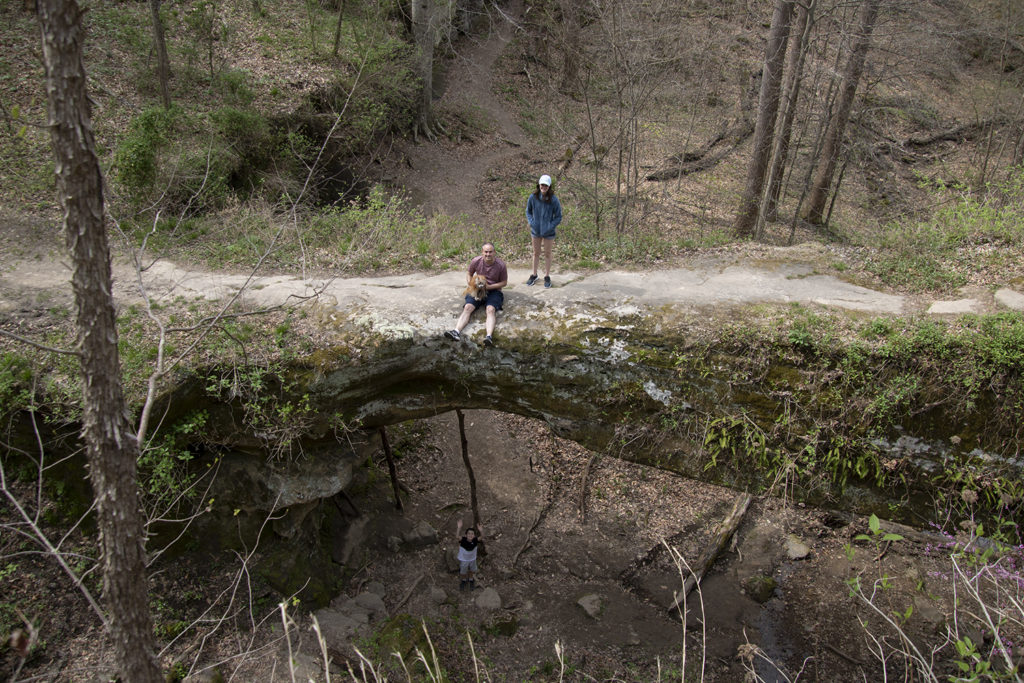 Sitting on Pomona Natural Bridge