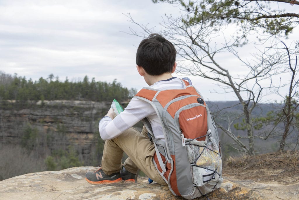 Eating road trip snacks while on a hike.