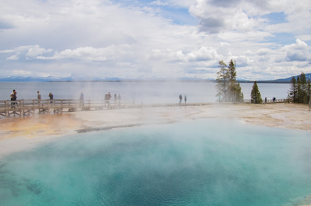 A view of a boardwalk along the lake in Yellowstone National Park.