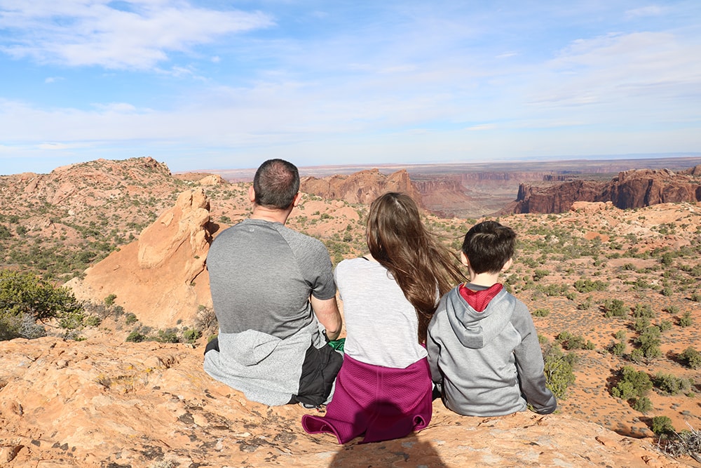 Dad & kids taking in the view at Canyonlands National Park