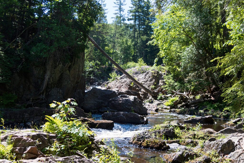 Explore the Natural Beauty of Dead River Falls In Marquette dead river falls rocky walls