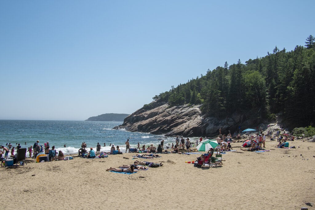 People enjoying Sand Beach in Acadia