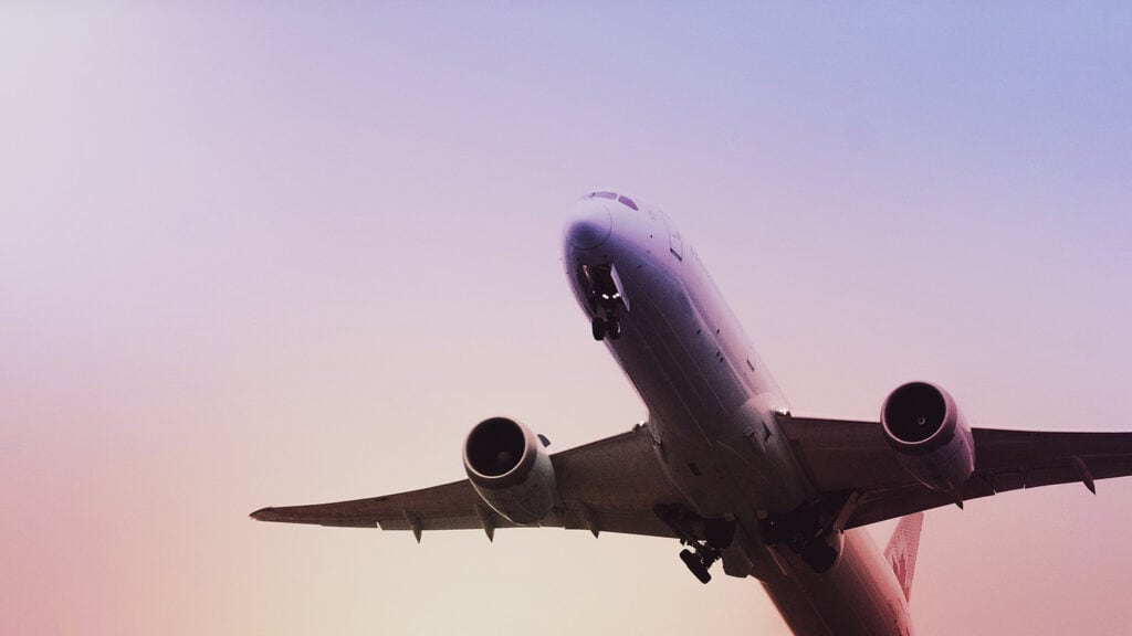 Image: A commercial airplane takes off from a runway, symbolizing closest airports to Zion National Park.