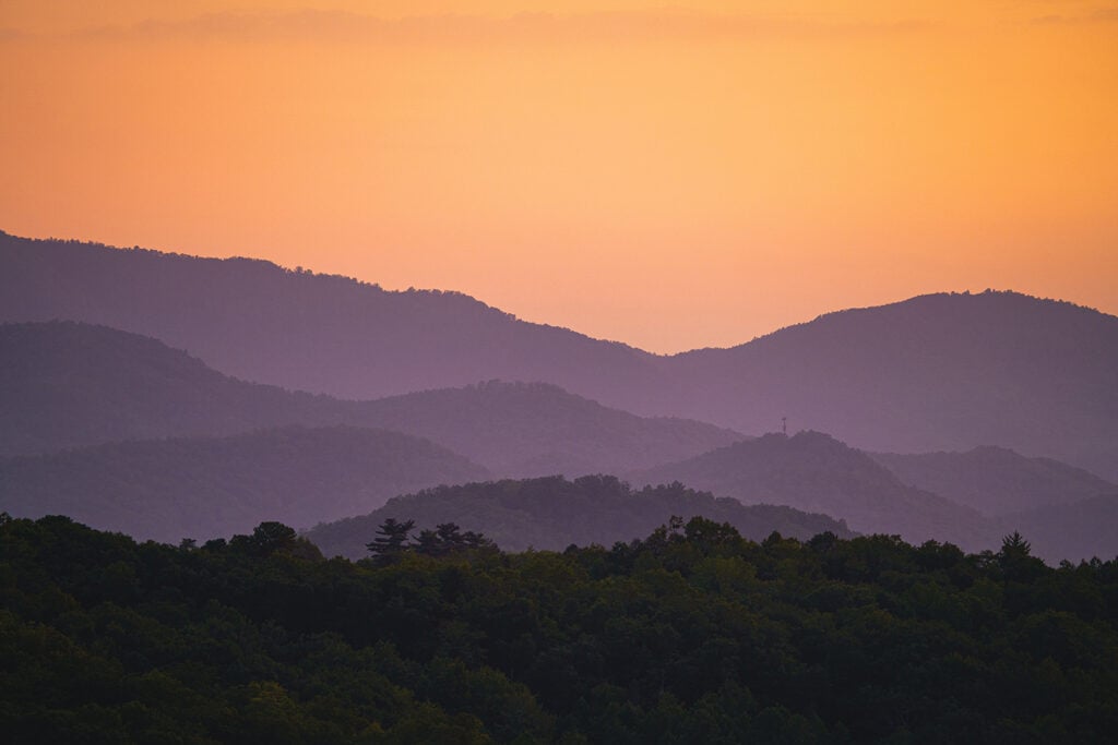 Orange sunset view of the Great Smoky Mountains ranges.