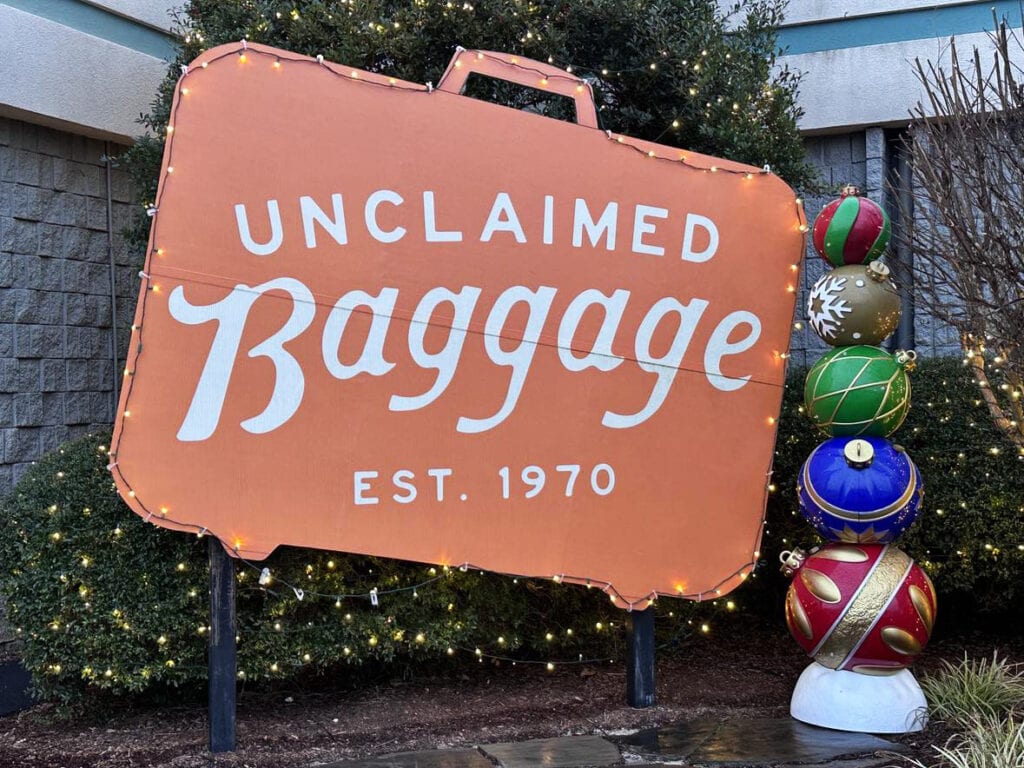 Sign for Unclaimed Baggage: Welcoming visitors to the unique retail destination in Scottsboro, Alabama.
