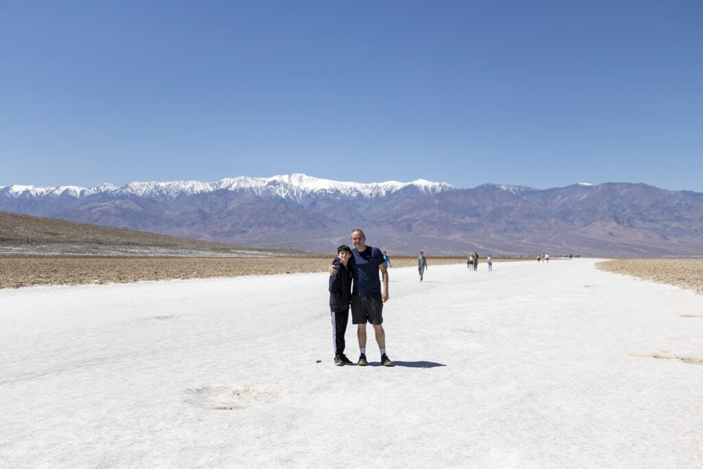 Salt flats at Badwater Basin, the lowest point in North America. A vast, otherworldly landscape with unique polygonal patterns, mirroring the unparalleled beauty of this Death Valley destination.