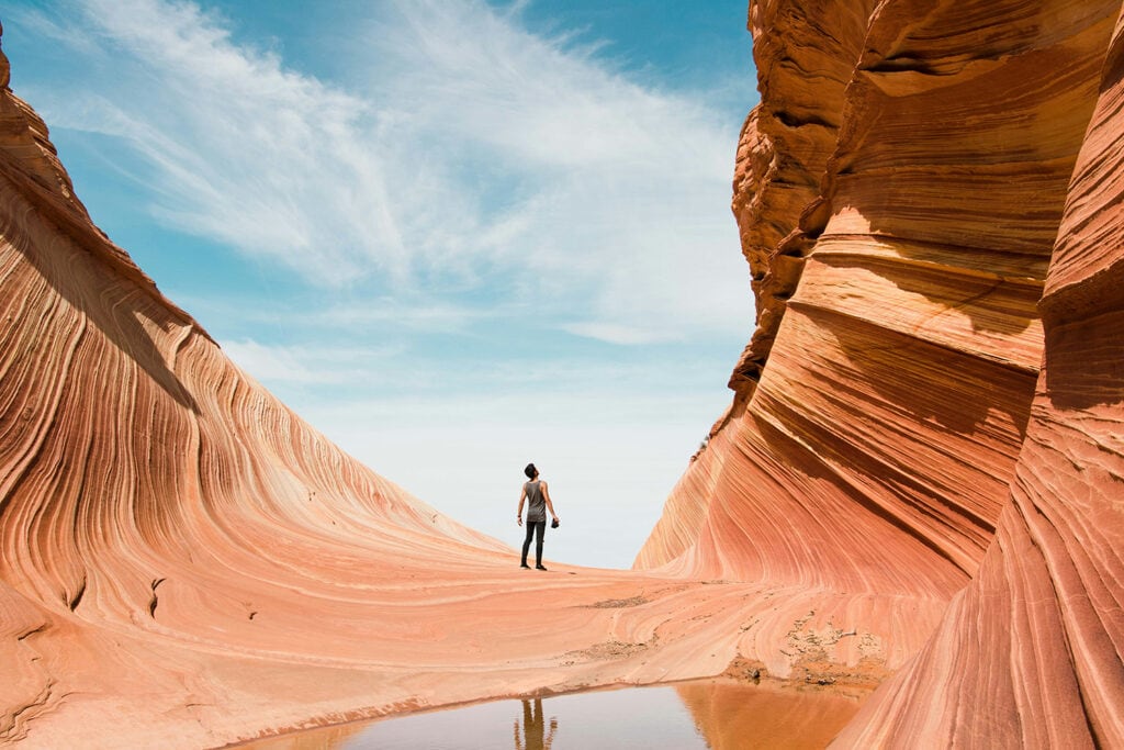 The Wave - A mesmerizing sandstone formation in the North Coyote Buttes of Arizona, showcasing swirling patterns and vibrant hues. A rare and sought-after destination, illustrating the unique beauty of the American Southwest